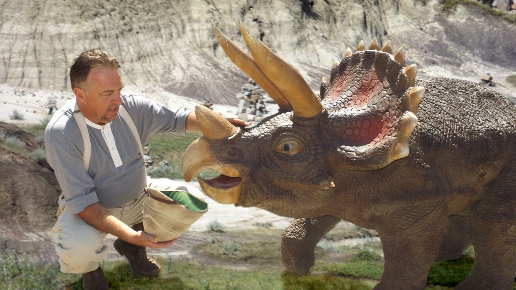 Cole befriends a young triceratops.